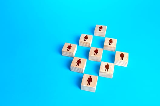 Figures blocks of people on a blue background. Concept of order, orderliness and uniform structure. Human resource management, hiring and staffing. Team building. Employee network. Business company photo