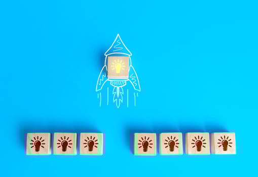 Block with the idea light bulb took off on an imaginary rocket doodle. Developing startup. Choosing best idea. Success investment. Business accelerator. Optimal solution. Creativity photo
