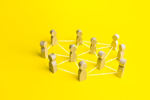 People connected by lines on a yellow background photo