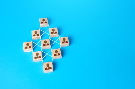 Connected people blocks on blue background. Concept of order, orderliness and uniform structure. Team building. Employee network. Human resource management, hiring and staffing. management strategies photo
