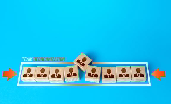 Blocks with employees are squeezed out of the shrinking progress bar. Reducing the composition of the team to fewer members. Reorganization, new company policy. Rise efficiency and productivity. photo