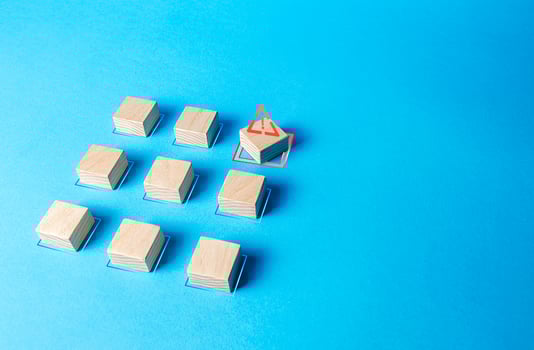One of the blocks breaks the formation. Violation of order, malfunction failure. Deviation from the norm. Determination and correction of the error. Disorder process. Discipline staggered photo