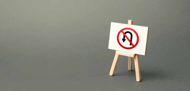 Easel with no turning back traffic sign. Assertiveness and striving, moving forward without retreating. Go to the goal, don't stop. Finish things. No step back photo
