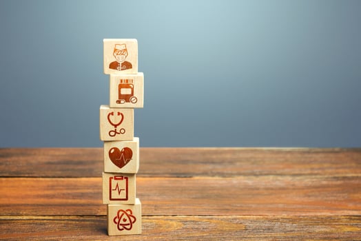Block tower with medical icons symbols. Healthcare and medical Insurance concept. Supplies, equipment and specialists for the normal functioning of hospitals in the fight against the pandemic. photo
