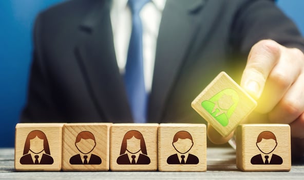 A businessman appoints a leader to a team. Leadership skills. Promising talented employee. Formation effective working group. Implementation of specialists professionals in to staff. Management photo