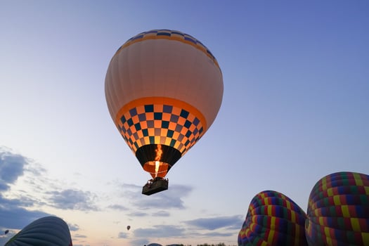 white an yellow Hot Air Balloon in Cappadocia, Nevsehir, Turkiye photo
