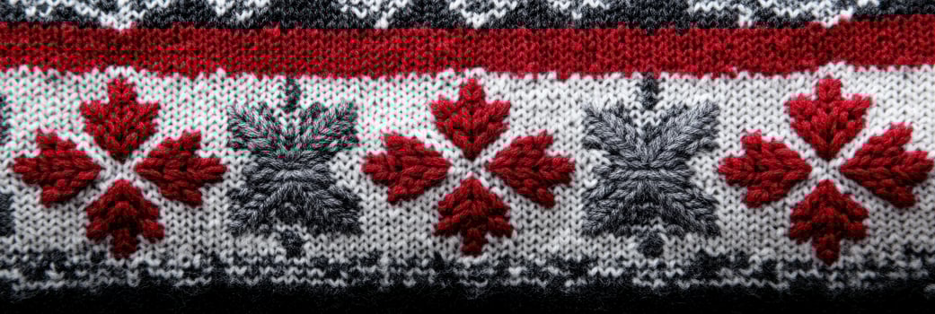 Knitted winter sweater pattern with red and gray snowflake design photo