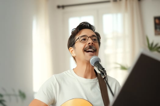 joyful man passionately singing into a microphone during an acoustic performance photo