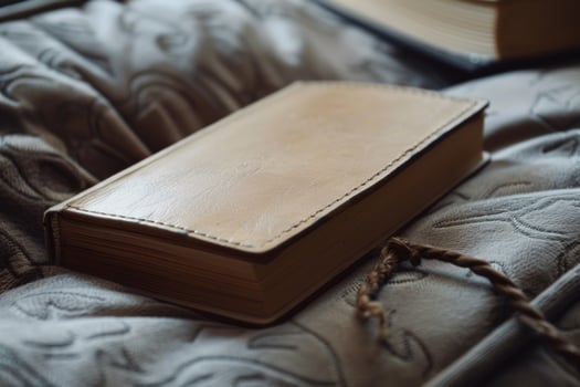 Leather bound notebook resting on soft blanket in cozy setting photo