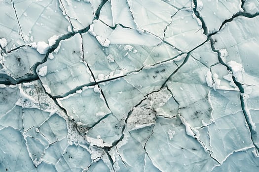 Frozen surface of cracked ice showing effects of climate change photo