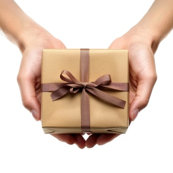 Woman holding brown gift box with brown ribbon photo