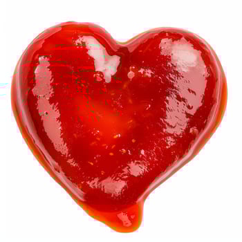 Red tomato ketchup sauce heart shape isolated on white background photo