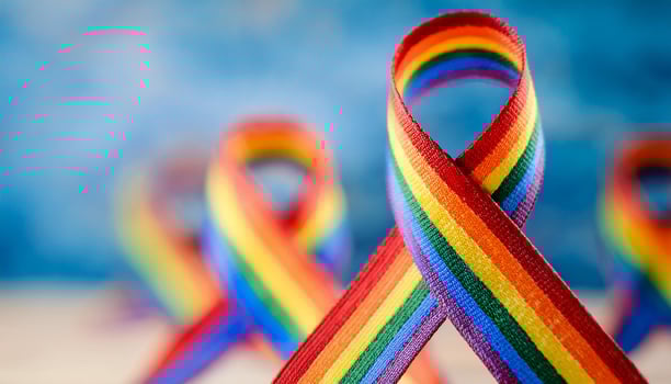 Rainbow ribbon, symbol of autism awareness, World Autism Awareness Day. photo