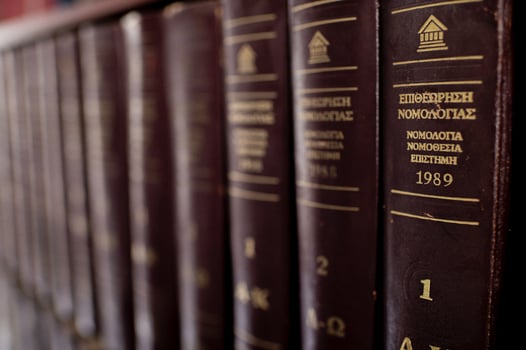 The spines display titles on constitutional law, civil code, and legal theory, creating an atmosphere of scholarly depth and expertise. photo