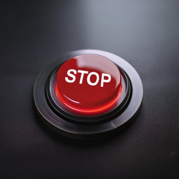 Round glowing red button with word STOP. Element of control panel. Modern equipment photo