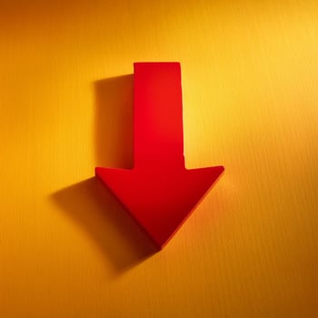 Red wooden arrow pointing downwards on yellow background. Business and market growth. photo