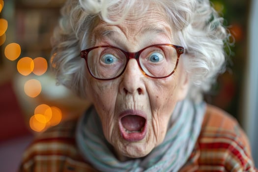 Shocked senior woman opening mouth wearing eyeglasses, photo