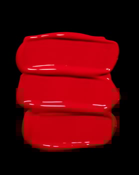 red lipstick smeared on black background, cosmetic or beauty product texture photo