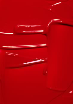 red abstract textured background, cosmetic or beauty product texture, red lipstick or lipgloss photo