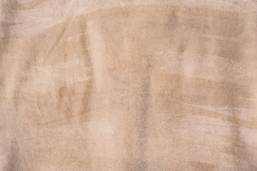 Beige suede background macro photo. Suede leather. photo