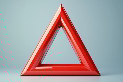 Red triangle standing on light blue background representing danger or warning photo