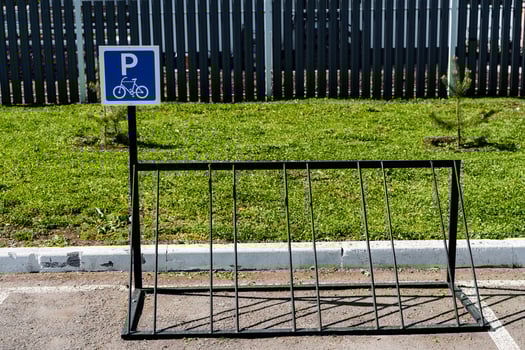 A bike rack with a sign on it photo