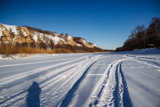A long trail of snow on the ground photo