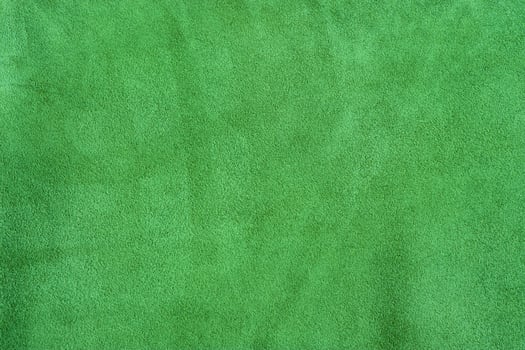 The texture of suede is green-colored. Natural leather texture photo