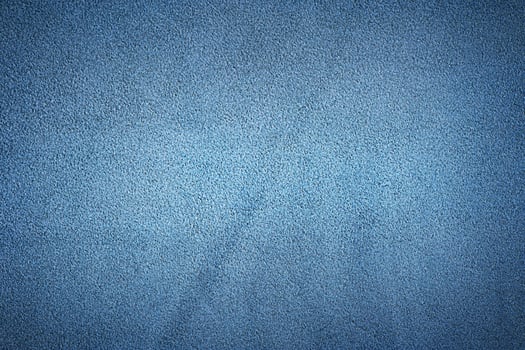 Blue suede genuine leather as a background macro photo. photo