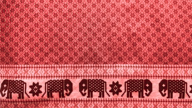 A red background with elephants on it photo
