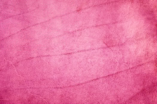 Pink suede textured background macro photo. photo