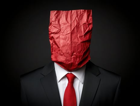 Anonymous businessman in a red paper bag photo