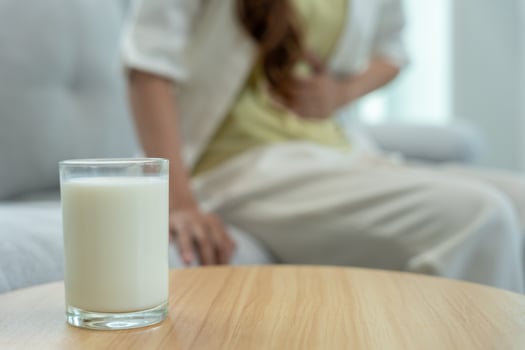 Milk allergens, Sick sad unhealthy ill allergic woman, runny stuffy sore nose suffer from intolerance allergy trigger symptoms. abdominal pain, allergens, nut protein, rash, death, food allergy. photo