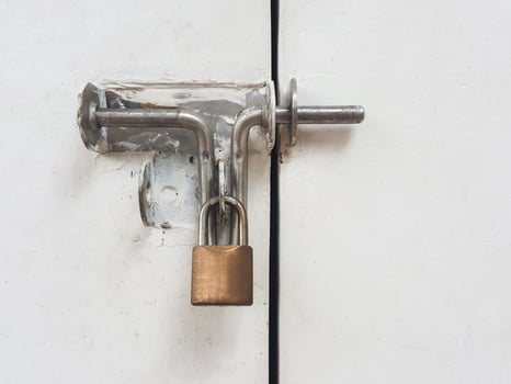 Lock on a white metal gate photo