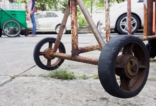 Wheels old, steel panel to block entrances. photo