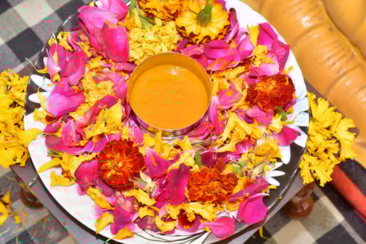 A plate with flowers and a cup of orange juice photo