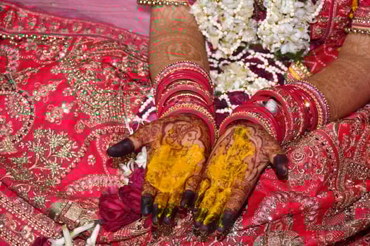 A bride with her hands decorated with henna photo
