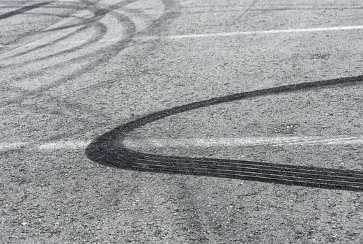 Asphalt with drift traces of tires photo