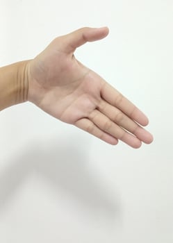 Closeup Asian female hands reaching for each other, help, shaking hands, sign arm and hand isolated on a white background copy space symbol language photo