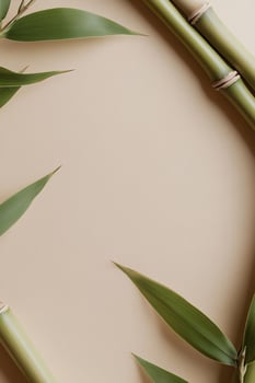 Bamboo stalks gracefully arch inward, creating a calming circular frame set against a soft beige backdrop. Ideal for showcasing branding or product information in a natural setting photo