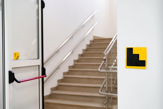 Staircase entrance with accessible features in a modern building photo