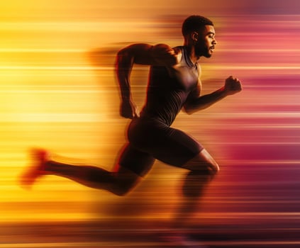 Dynamic runner in motion against a colorful blurred background showcasing speed and athleticism photo