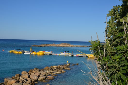 Excursion and fishing boats moored on a beautiful beach of a Maldives in the blue water. photo