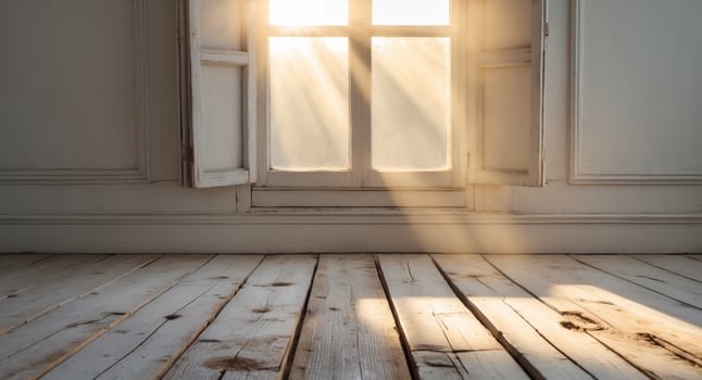 Soft morning sunlight shining through window onto rustic wooden floor. photo