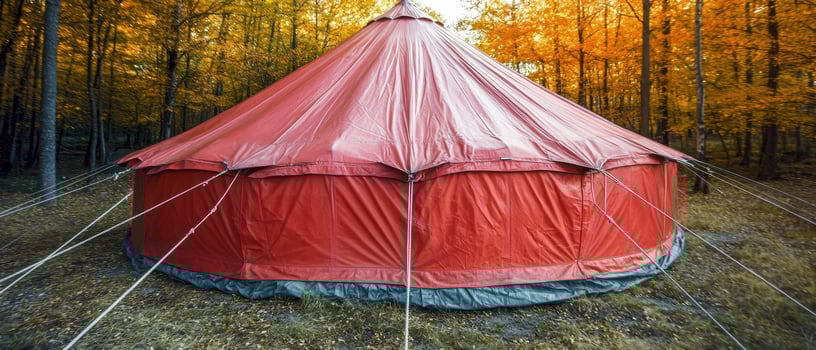 Red tent in autumn forest photo
