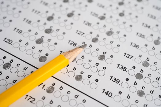 Answer sheets with pencil drawing fill to select choice, photo