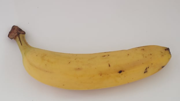 photo of a large, bright yellow banana