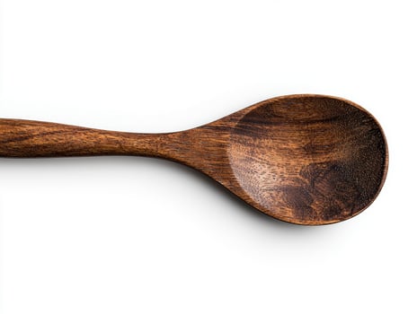 A wooden spoon on white background photo