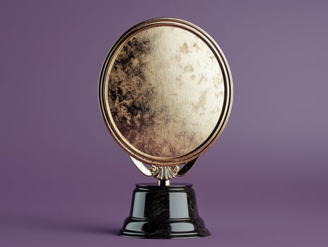 Blank gold award plaque on black marble base photo