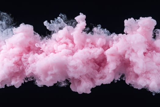 Pink smoke cloud on black background photo